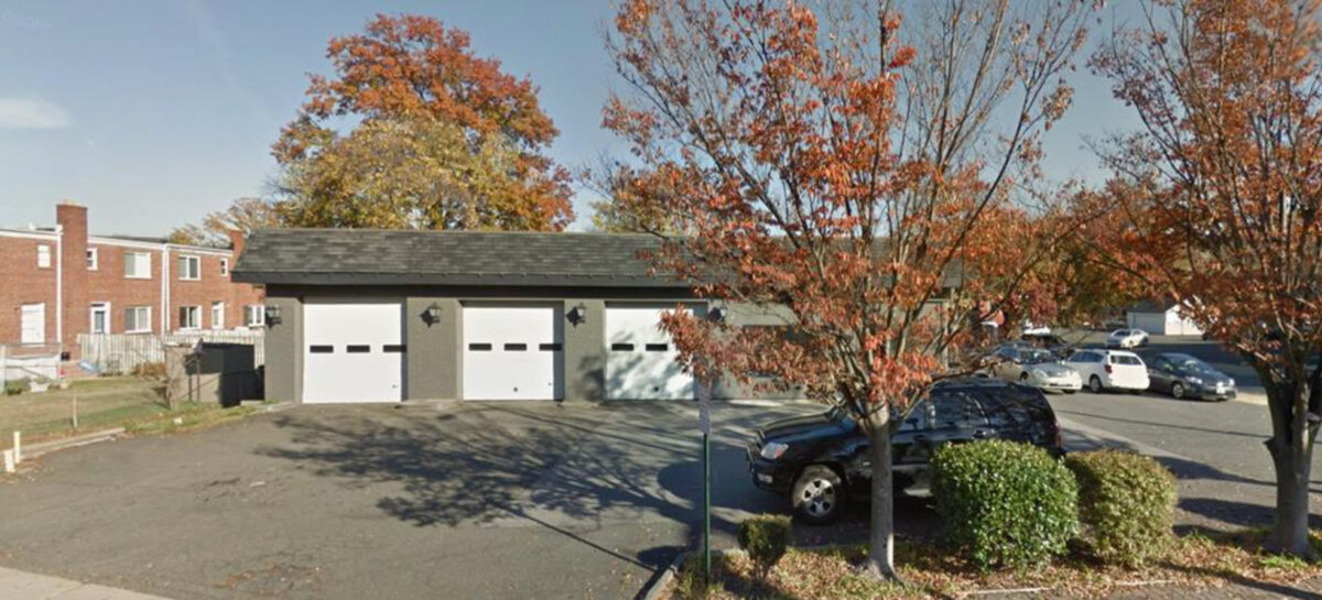 Photo of a garage with three doors