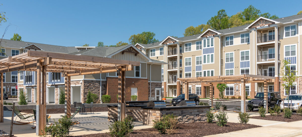 Photo of multifamily building with outdoor cooking area and grills