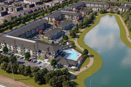 Aerial view of multifamily development with a pool and lake