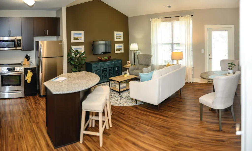 Open-plan kitchen and living room in an Aspire West End model apartment.