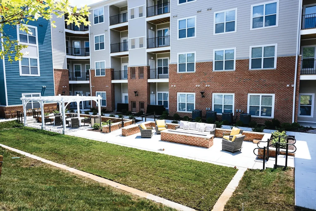 Outdoor fire pit and seating courtyard at Aspire West End.